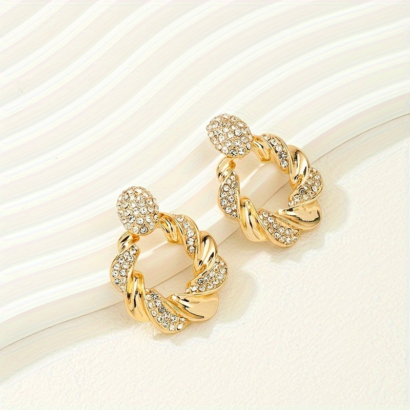 Hollow Twisted Pattern Dangle Earrings with Rhinestone Inlay